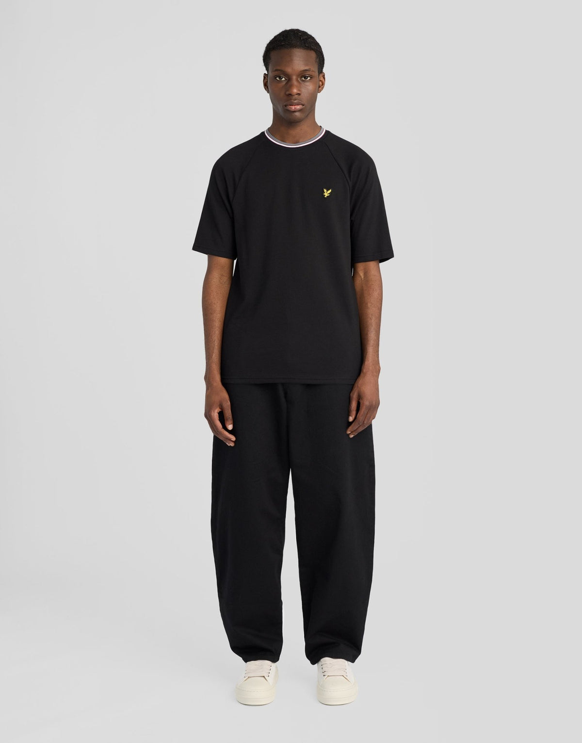 Man wears Tipped Track T-Shirt in Jet Black