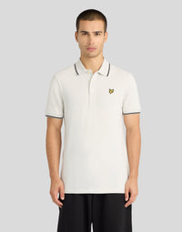 Man wears Tipped Polo Shirt in Glacier grey/ Jet black