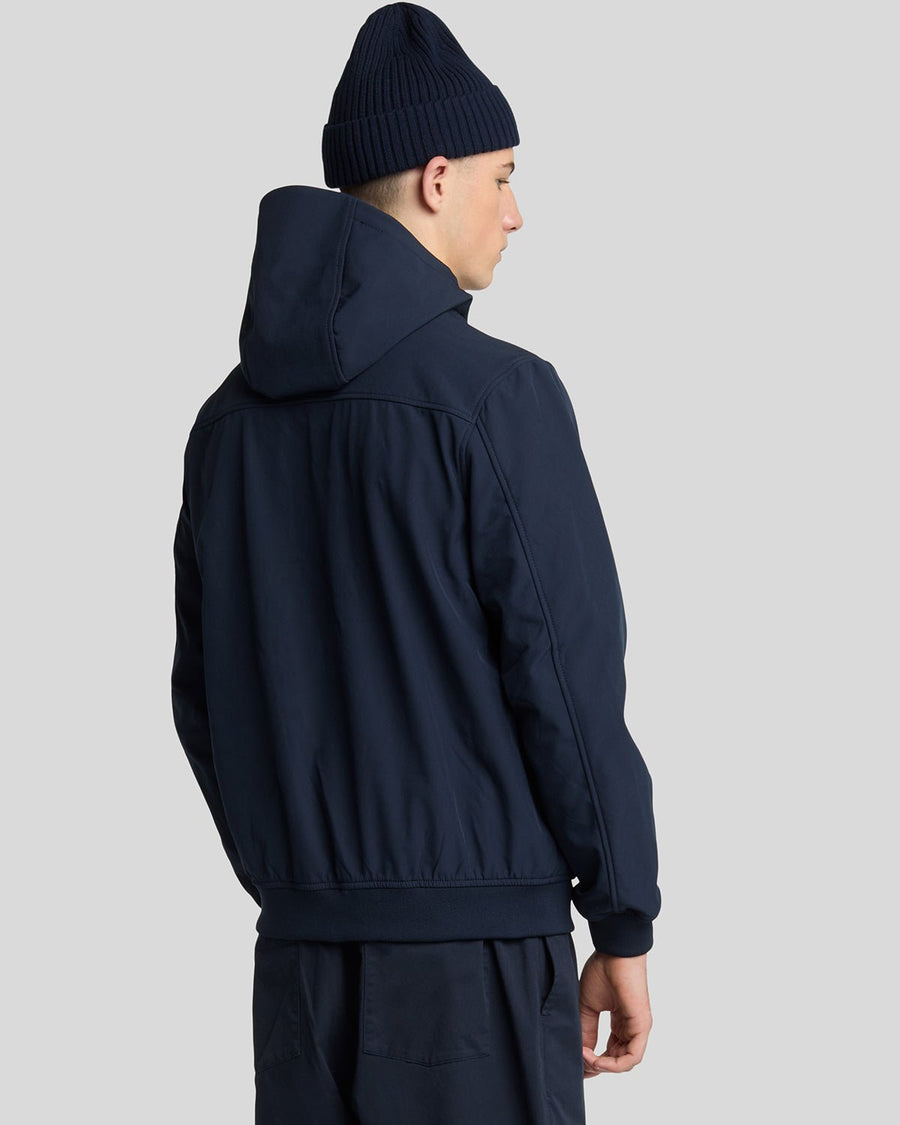 Man wears Fleece Lined Softshell Jacket in Dark Navy