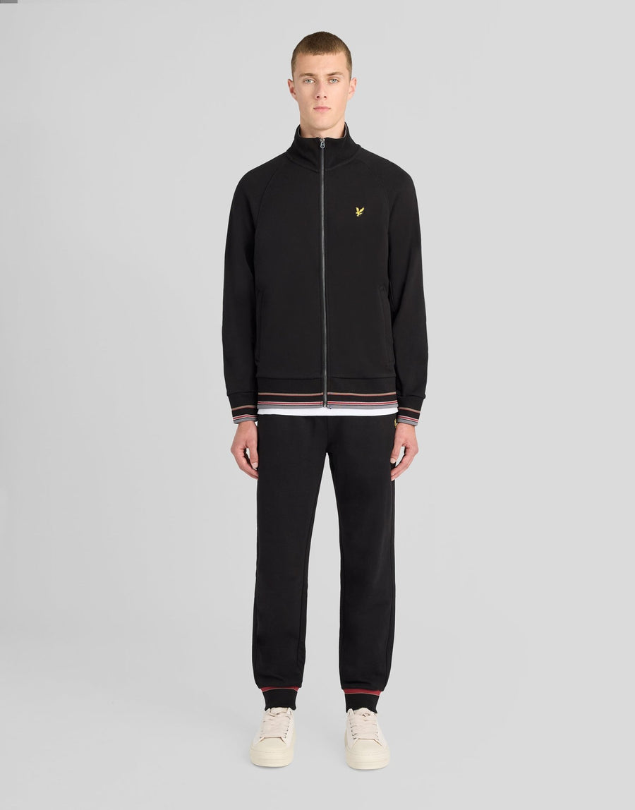 Man wears Cotton Tipped Track Jacket in Jet Black
