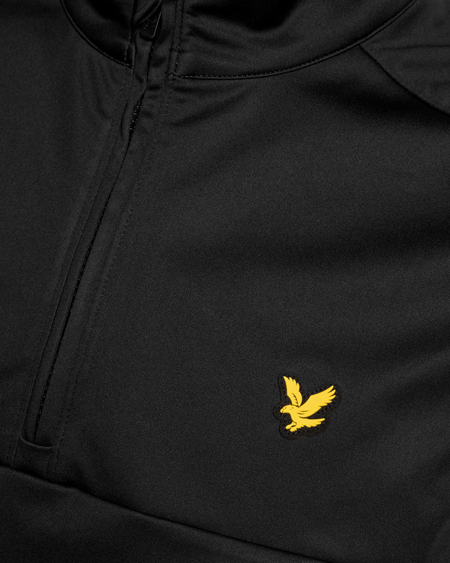 Man wears Windproof 1/2 Zip Gilet in Jet Black