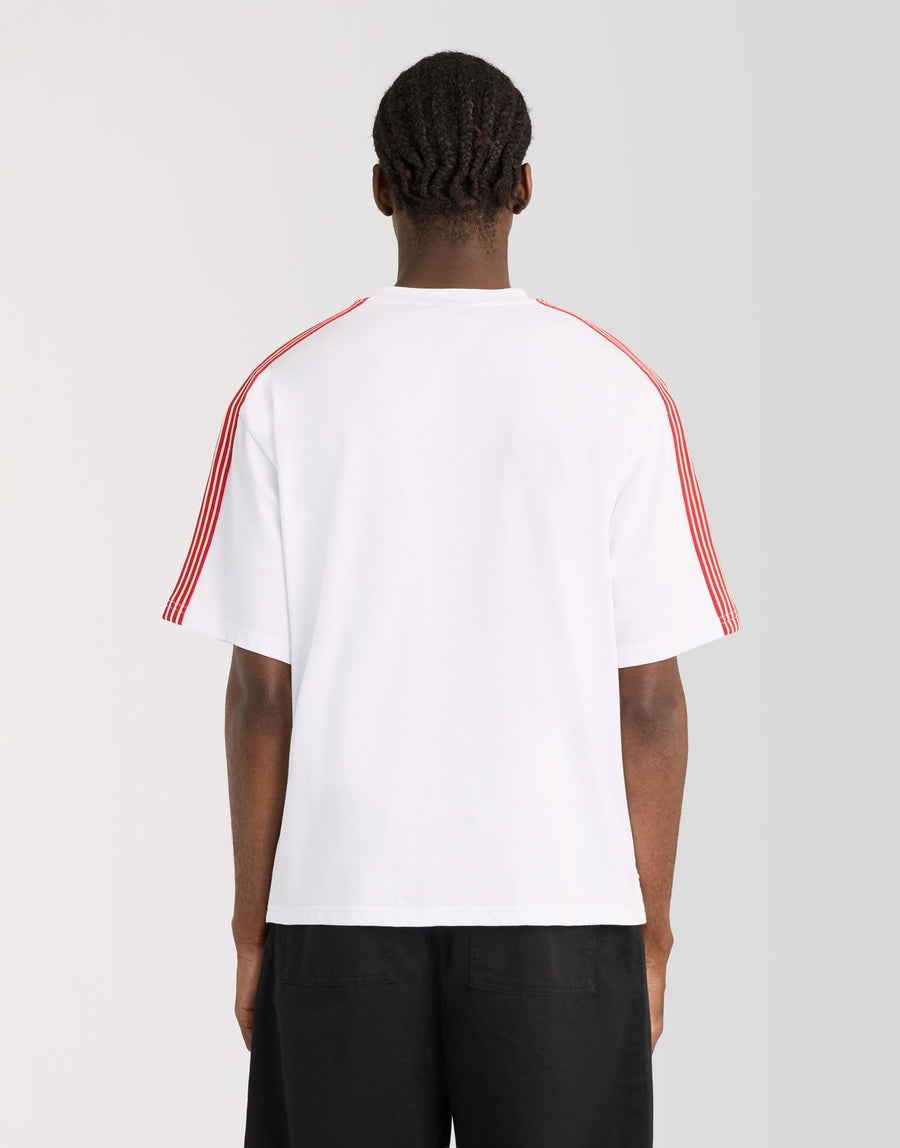 Man wears Stripe Taped Cotton T-Shirt in White