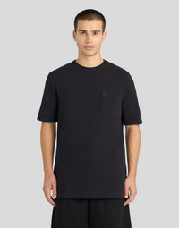 Man wears Pique Interlock Cotton T-Shirt in Lacquer