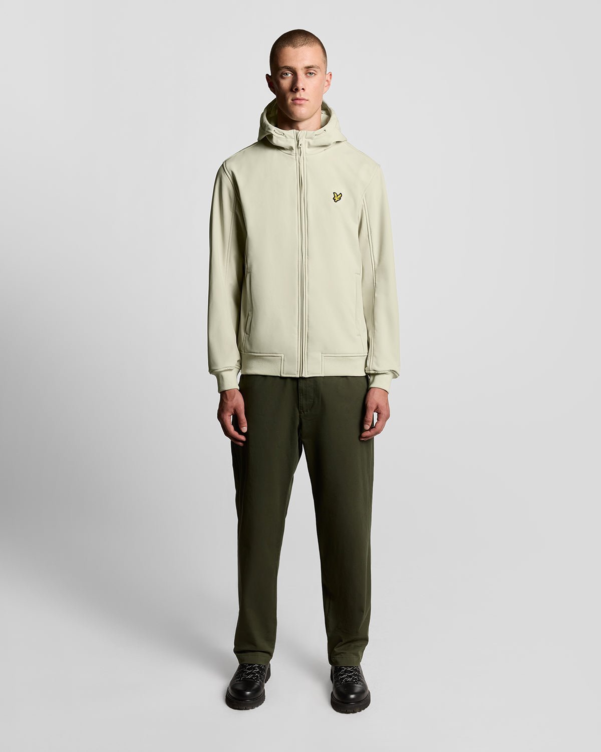 Man wears Fleece Lined Softshell Jacket in Grey Taupe