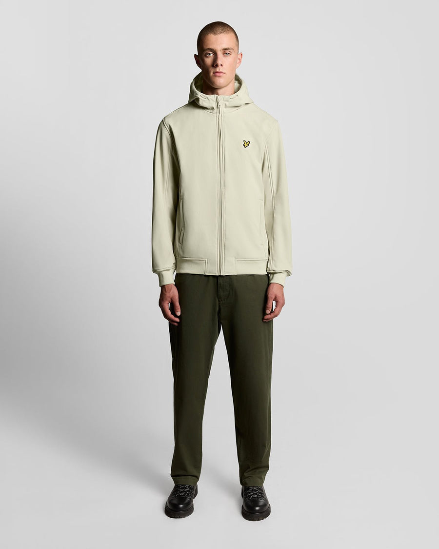 Man wears Fleece Lined Softshell Jacket in Grey Taupe