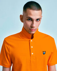 Man wearing Lyle & Scott Dutch Flag Polo Shirt