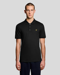 Man wears Everyday Cotton Polo Shirt in Saddle