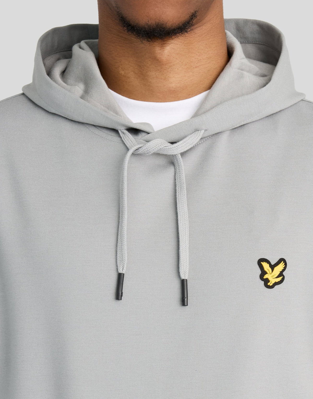 Man wears Sports Lightweight Hoodie in Ultimate Grey
