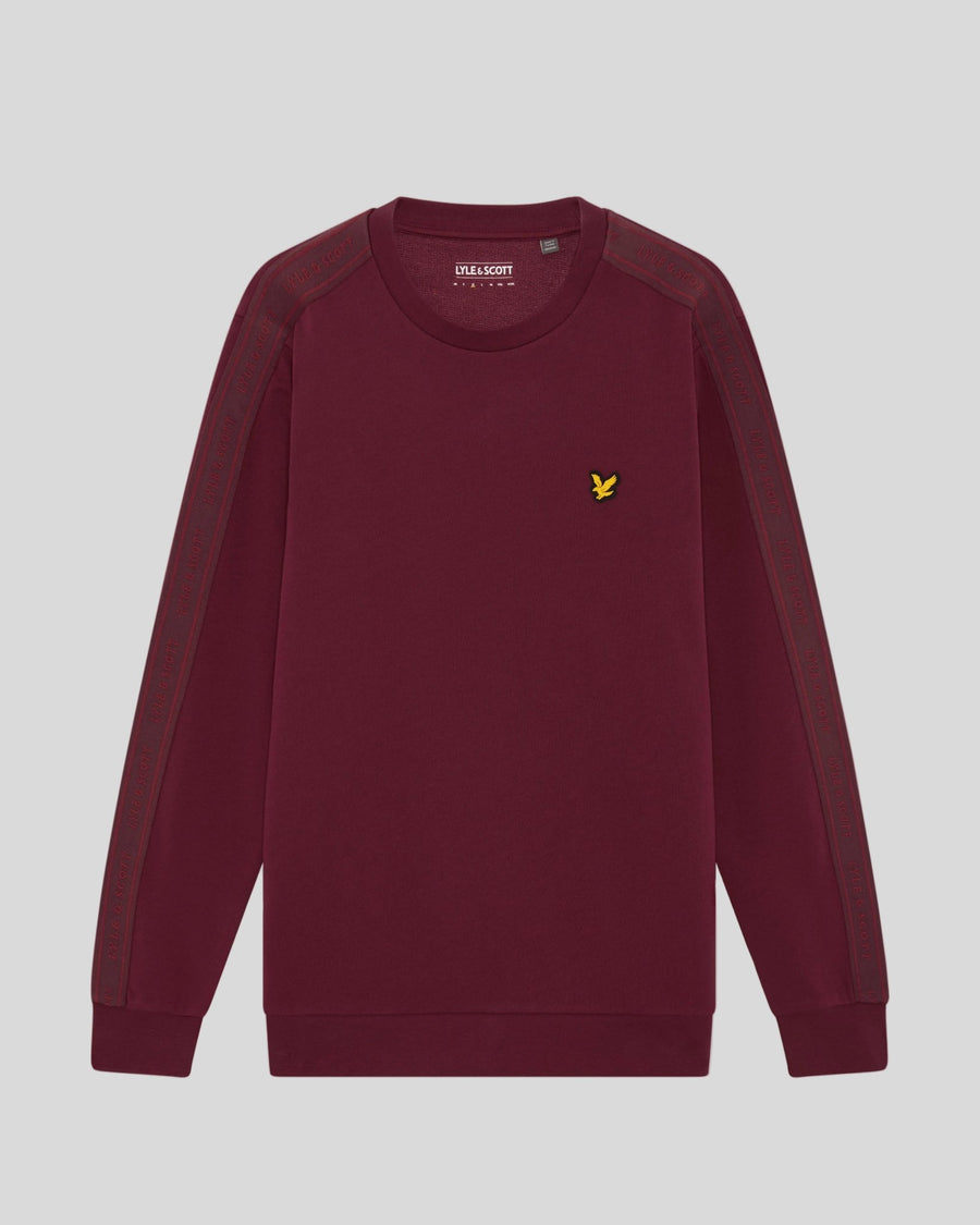 Man wears Sports Tape Crew Neck Sweatshirt in Plum