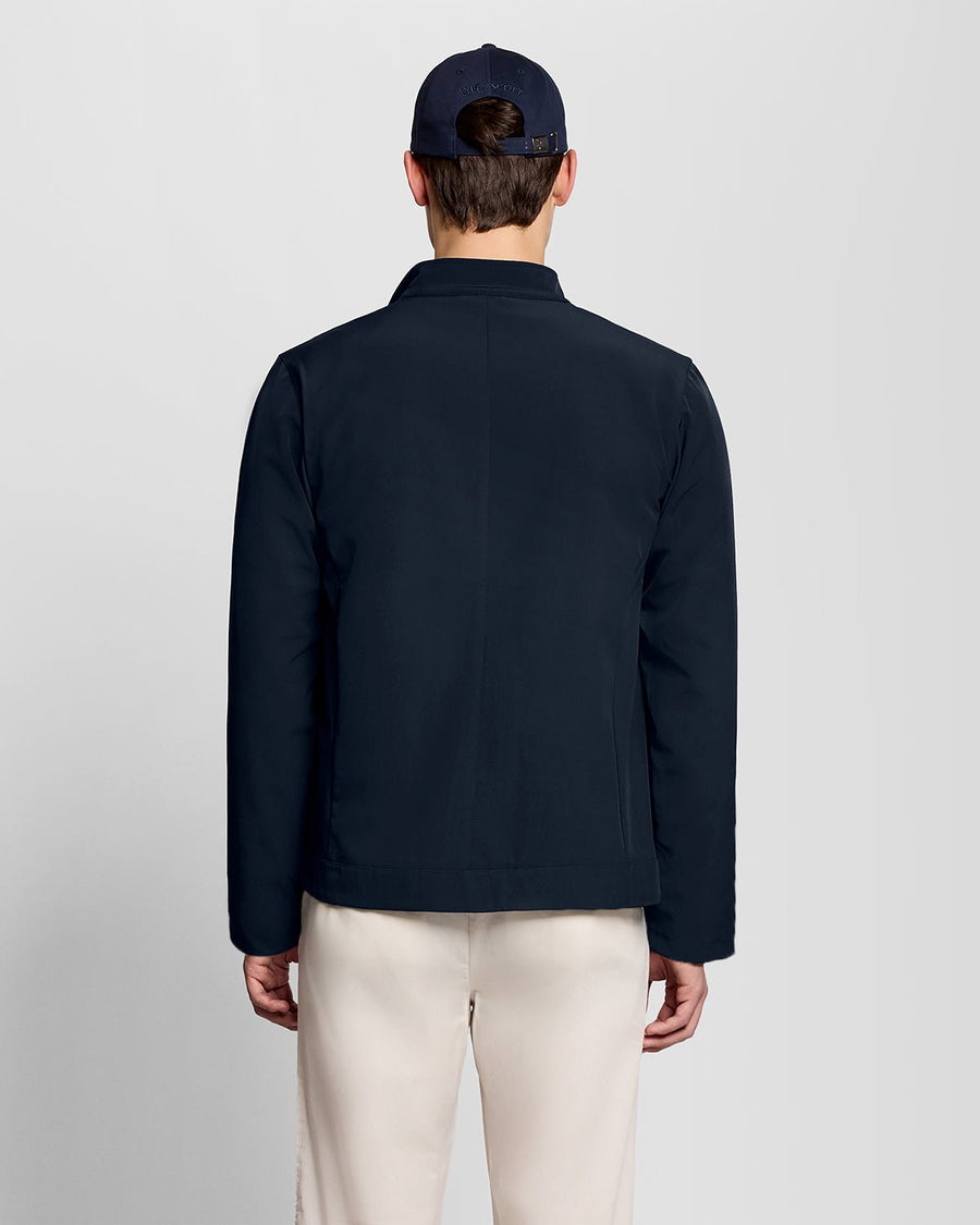 Man wears Lightweight Softshell Jacket in Carbon