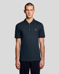 Man wears Everyday Cotton Polo Shirt in Carbon