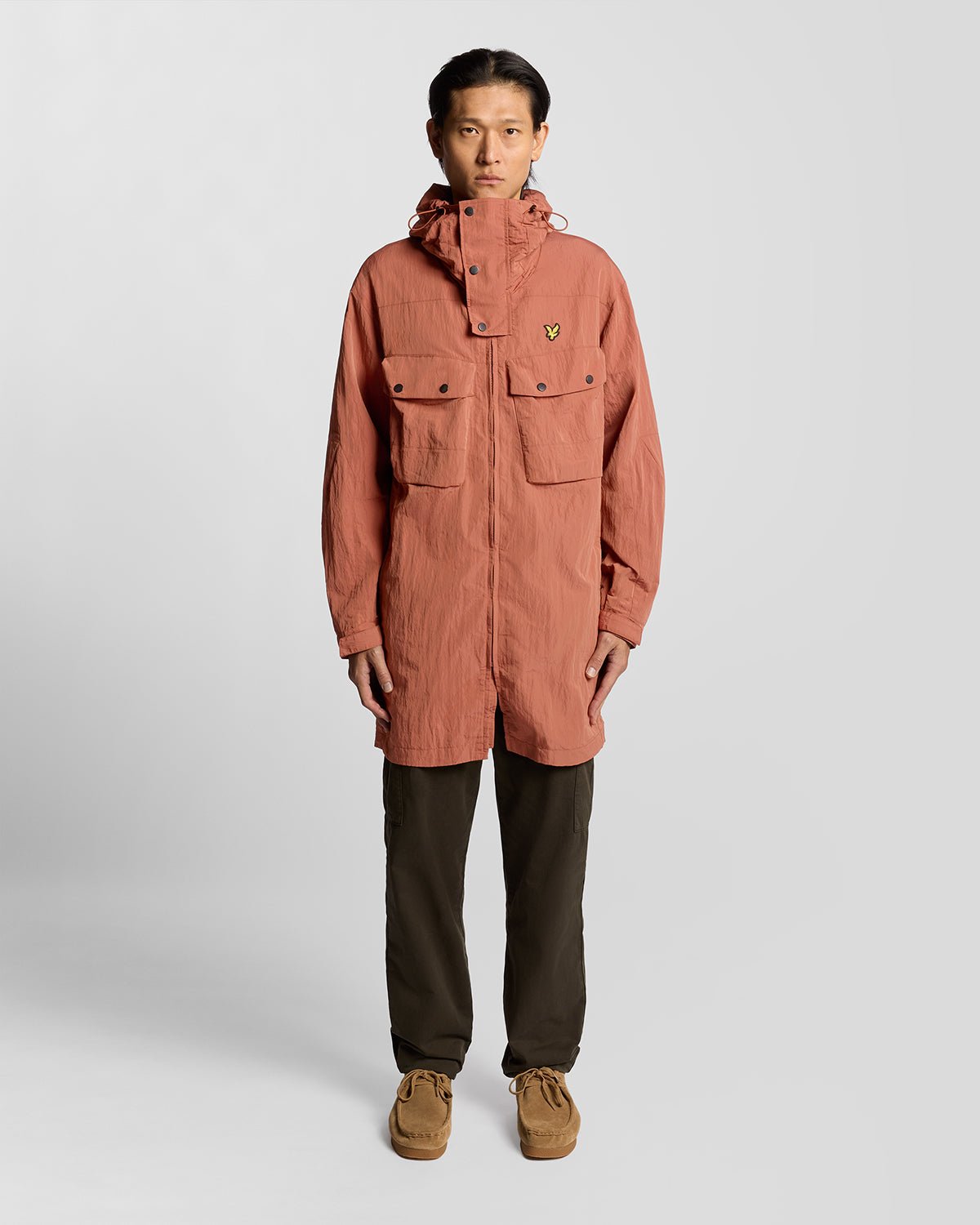 Man wears Water Resistant Guard Parka in Brick