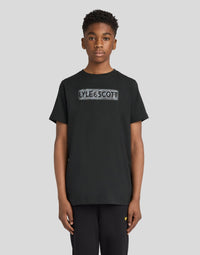 Boy wears Motion Logo Graphic T-Shirt in Jet Black