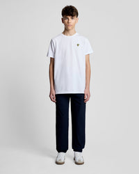 Man wears Cuffed Track Pants in Dark Navy