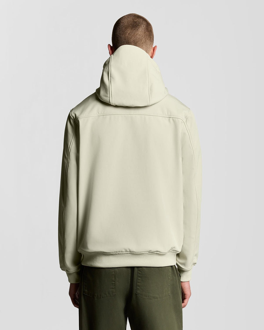 Man wears Fleece Lined Softshell Jacket in Grey Taupe