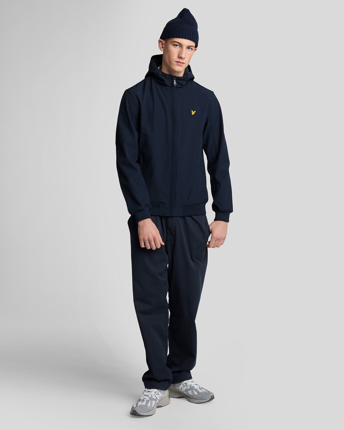Man wears Fleece Lined Softshell Jacket in Dark Navy