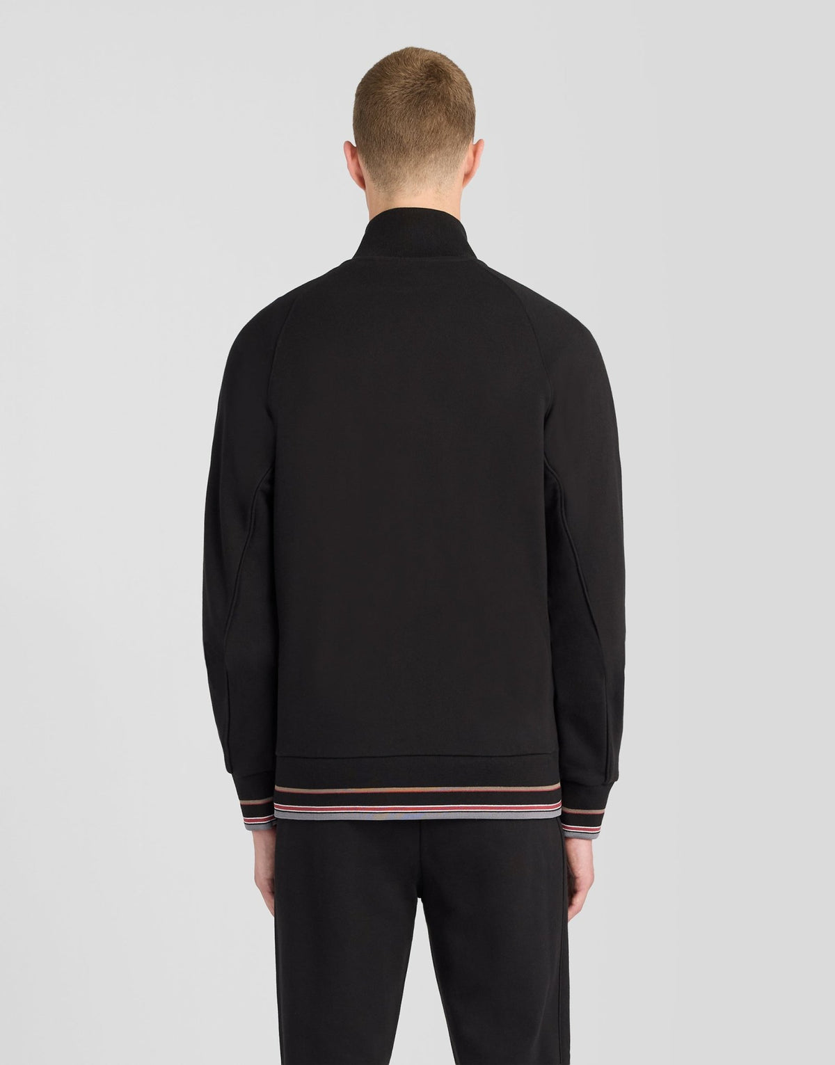 Man wears Cotton Tipped Track Jacket in Jet Black