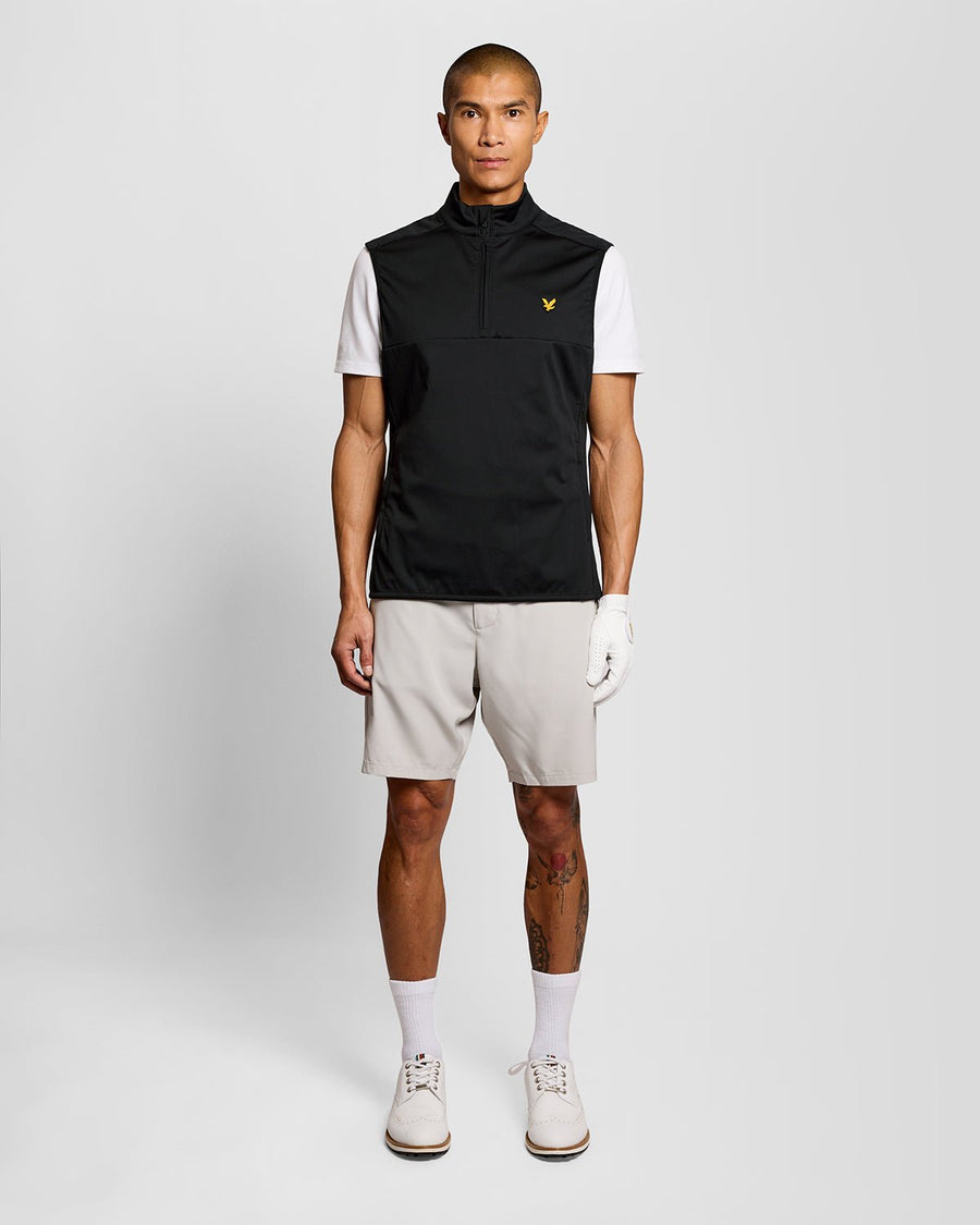 Man wears Windproof 1/2 Zip Gilet in Jet Black