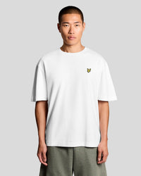 Man wears Ultra Soft Cotton Blend T-Shirt in White