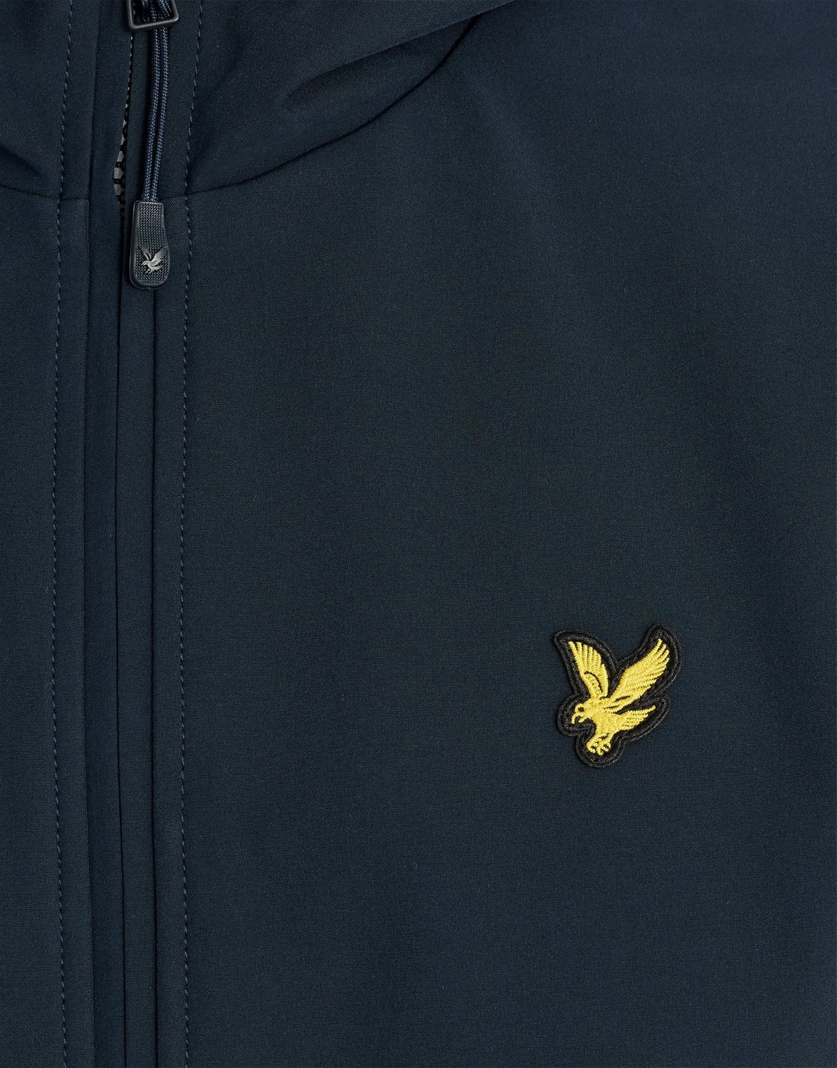 Man wears Sports Mesh-Back Softshell Jacket in Dark Navy