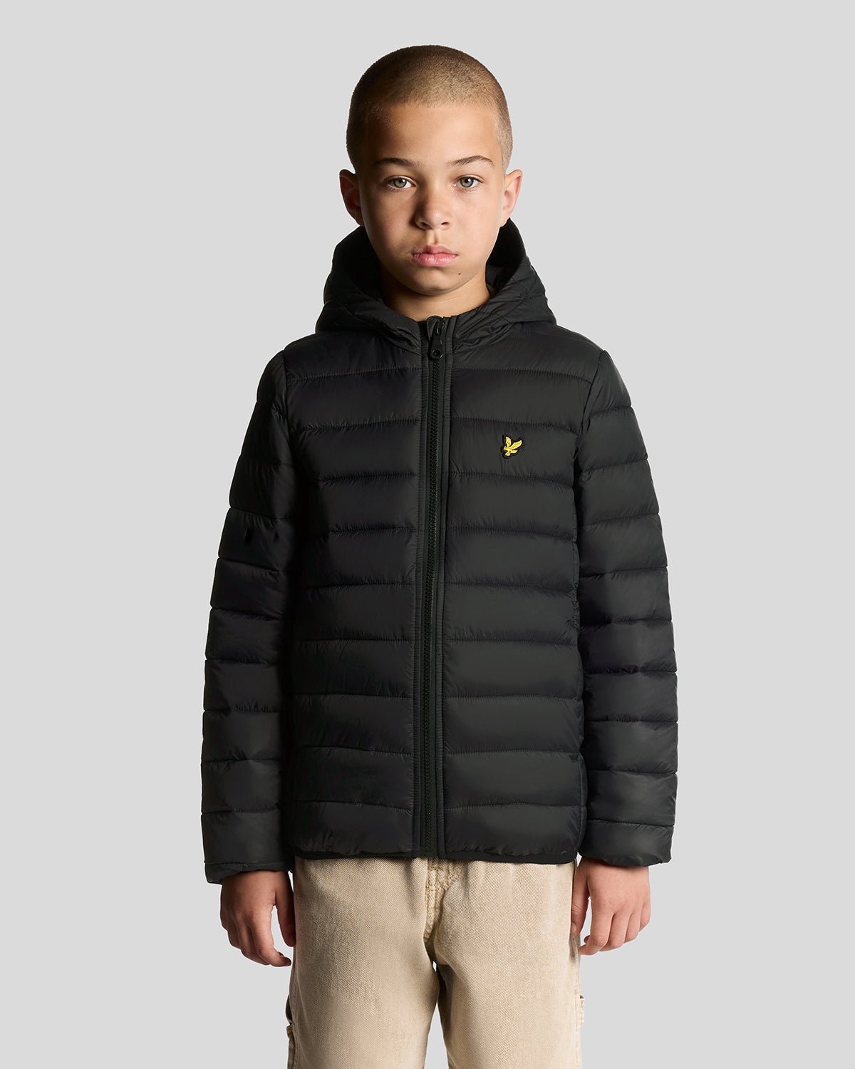 Boy wears Lightweight Padded Jacket in Jet Black