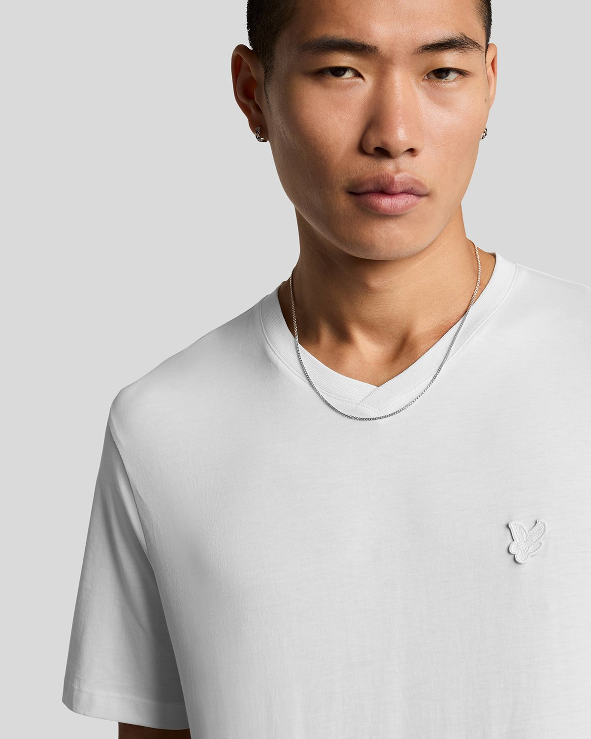 Man wears Superfine Cotton V-Neck T-Shirt in White