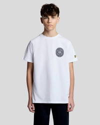 Man wears Graphic Badge Cotton T-Shirt in White
