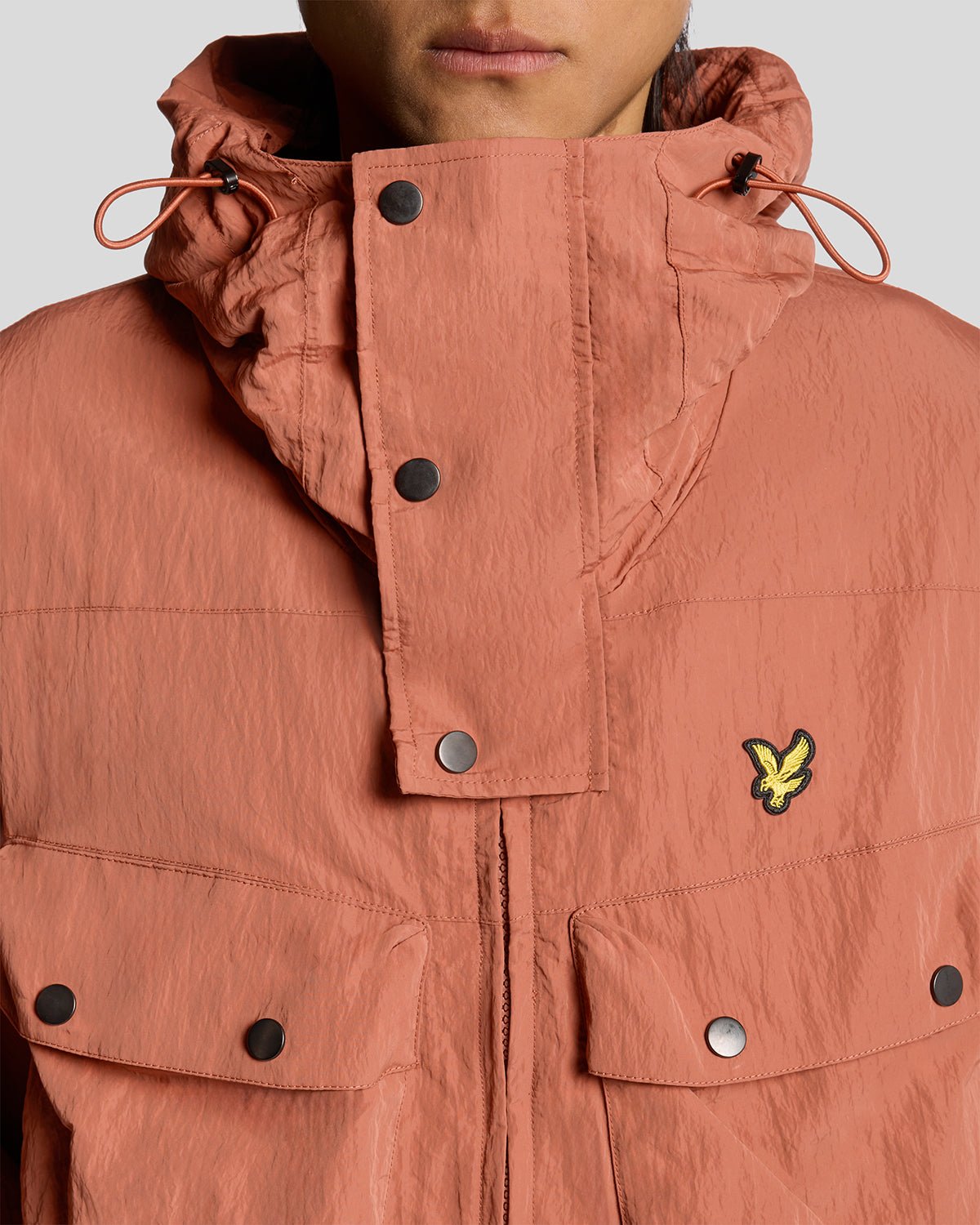 Man wears Water Resistant Guard Parka in Brick