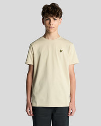 Man wears Cotton Crew Neck T-Shirt in Wheat