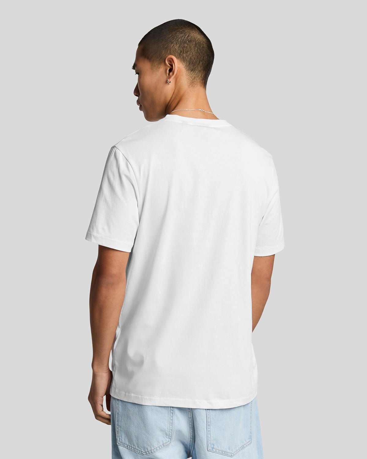 Man wears Superfine Cotton V-Neck T-Shirt in White