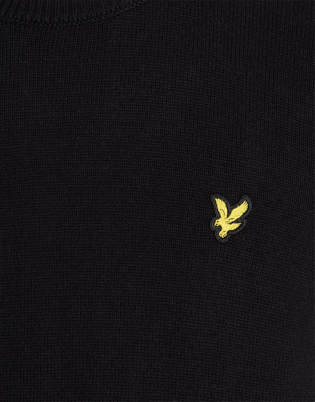 Man wears Cotton Merino Crew Neck Jumper in Jet Black