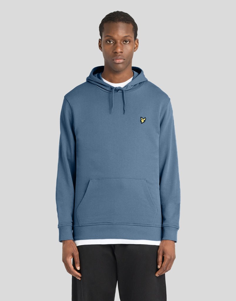 Man wears Everyday Loopback Cotton Hoodie in Ocean Sky