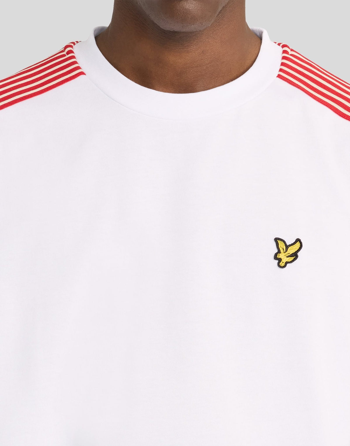 Man wears Stripe Taped Cotton T-Shirt in White