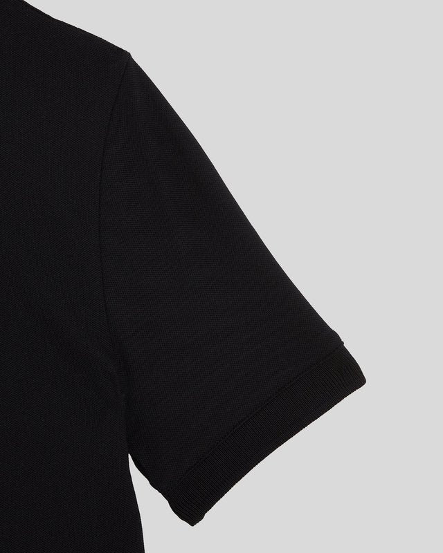 Garçon portant un polo en coton noir de jais