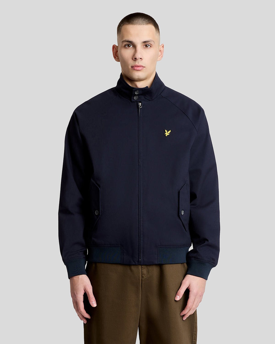 Man wears Cotton Harrington Jacket in Dark Navy