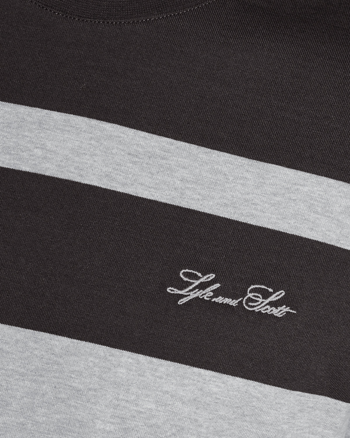 Man wears Relaxed Fit Stripe T-Shirt in Charcoal Grey/ Light Grey Marl