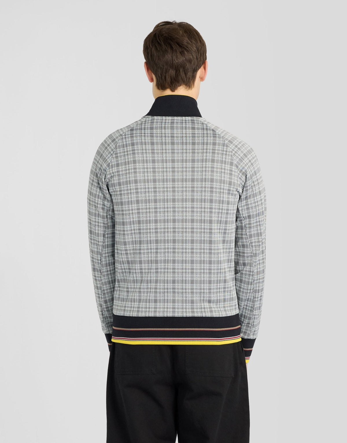 Man wears Hawick Cotton Check Track Jacket in Mid Grey Marl
