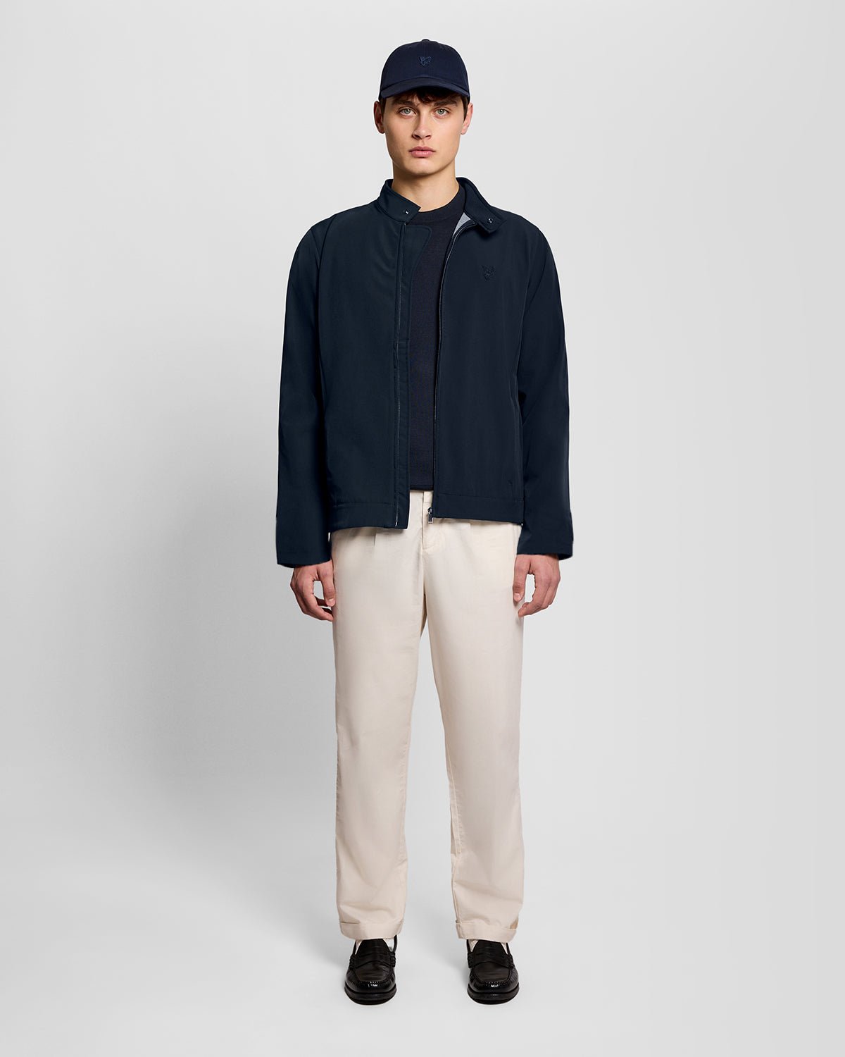Man wears Lightweight Softshell Jacket in Carbon