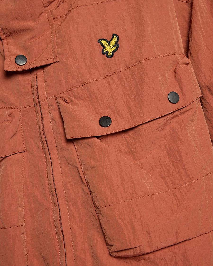 Man wears Water Resistant Guard Parka in Brick