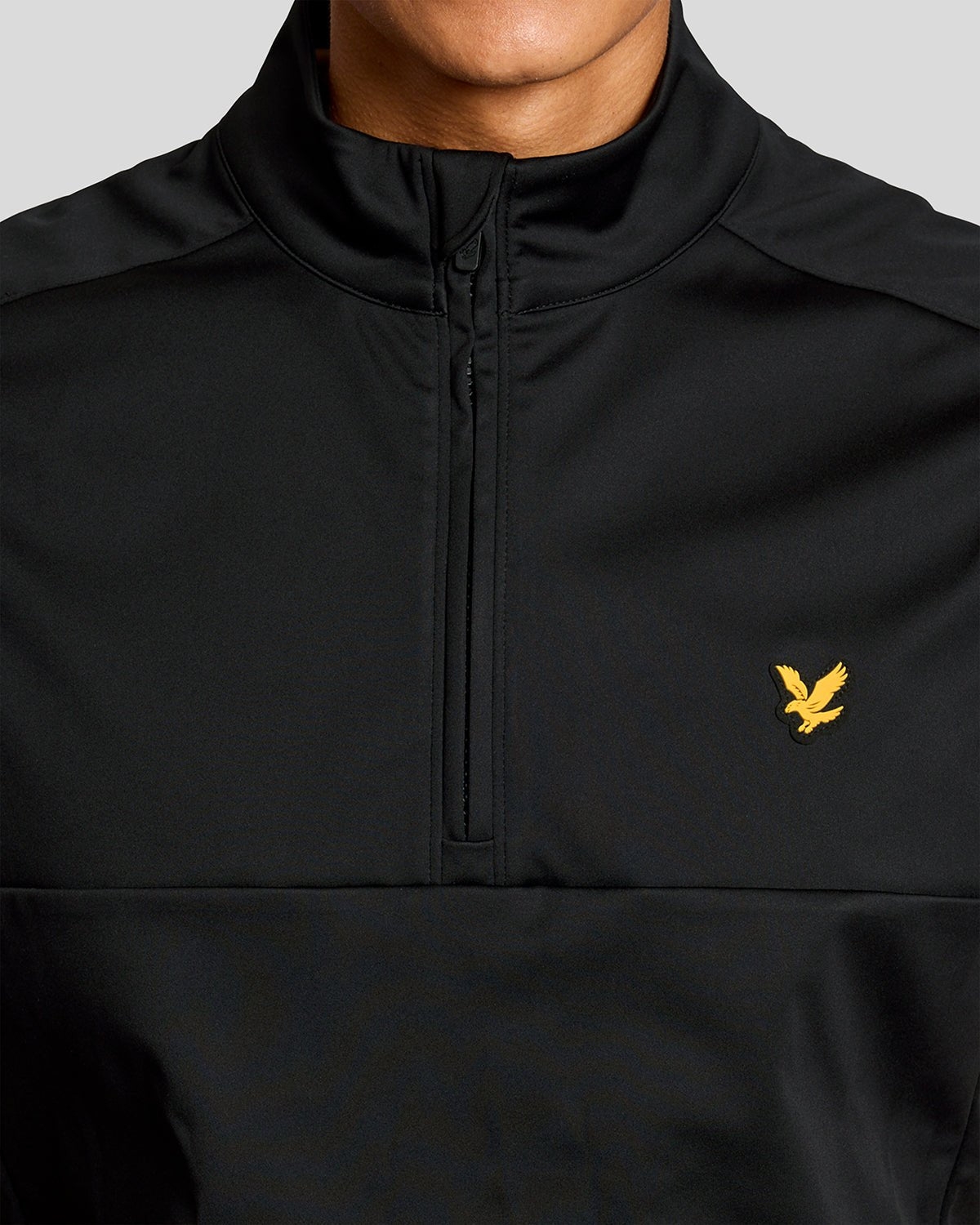 Man wears Windproof 1/2 Zip Gilet in Jet Black