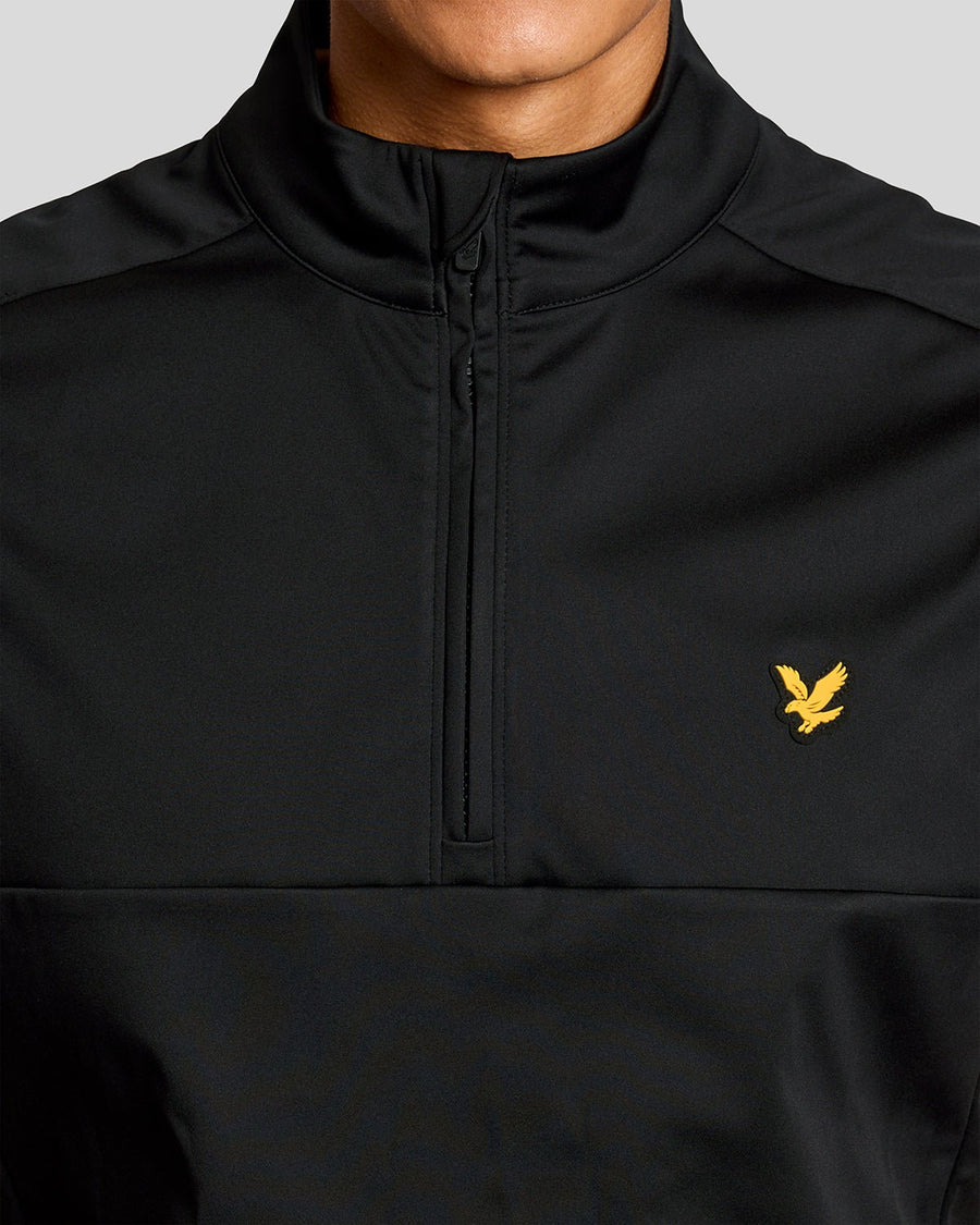 Man wears Windproof 1/2 Zip Gilet in Jet Black