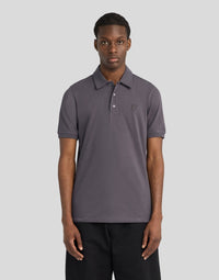 Man wears Superfine Cotton Polo Shirt in Iron