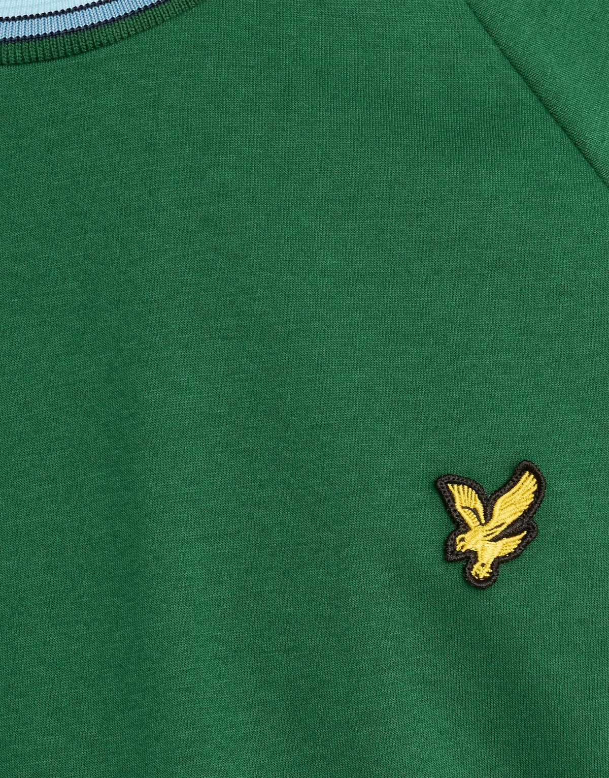 Man wears Tipped Track T-Shirt in Clover Green