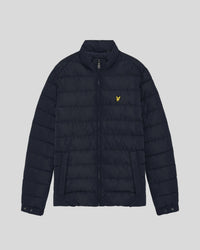 Man wears Quilted Jacket in Dark Navy