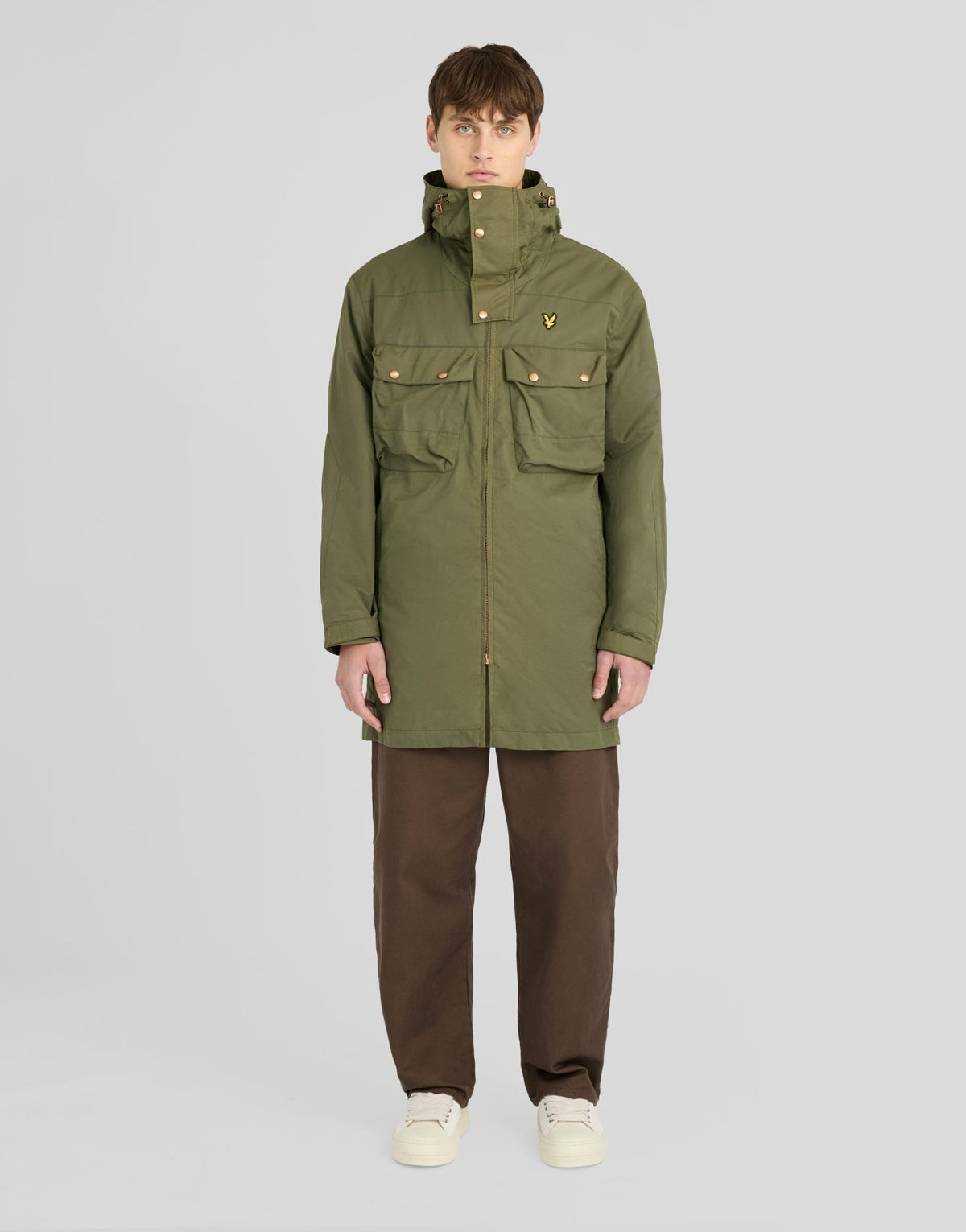 Man wears Waxed Guard Parka in True Olive