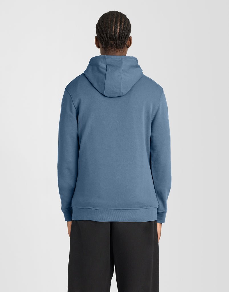 Man wears Everyday Loopback Cotton Hoodie in Ocean Sky