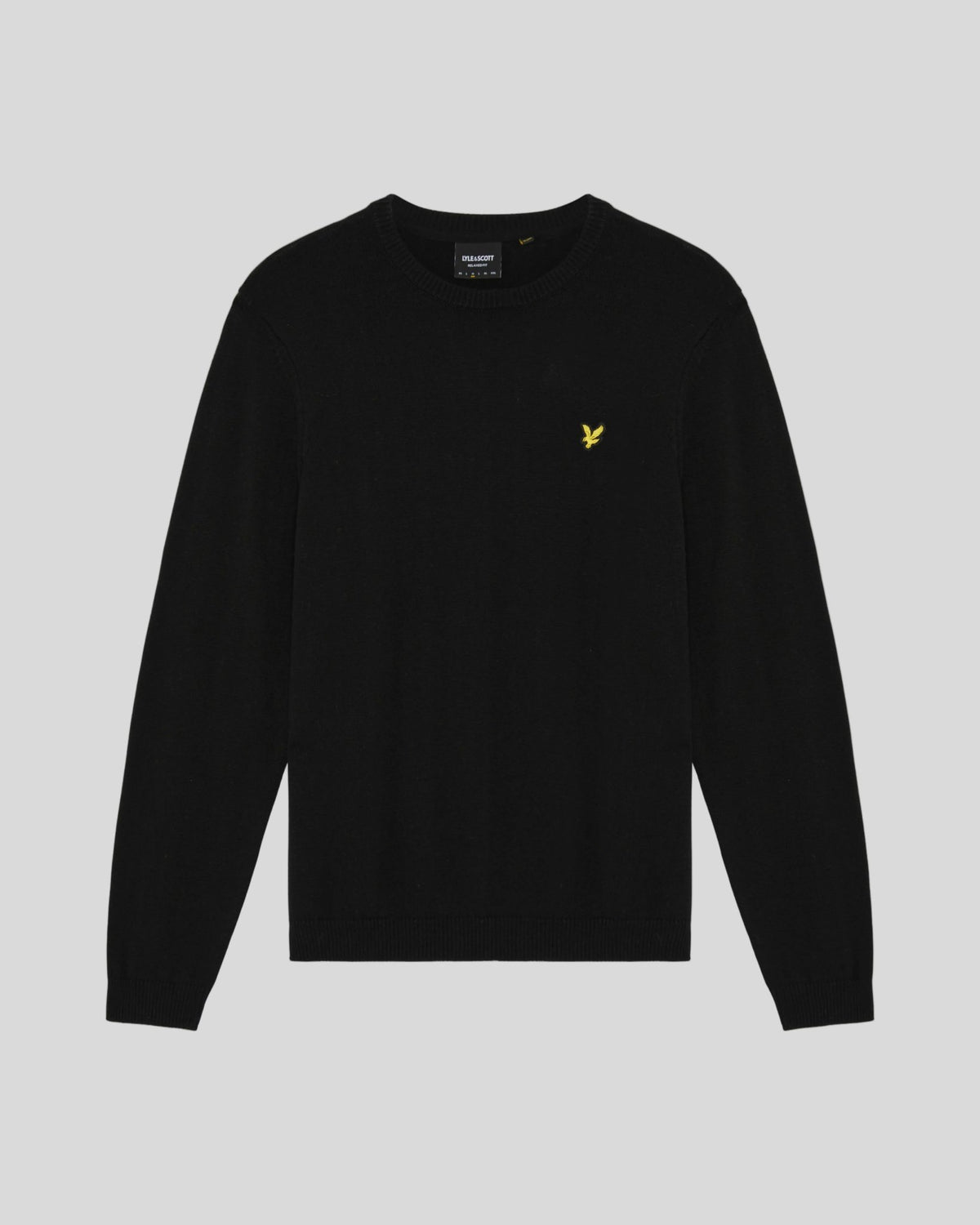 Man wears Cotton Merino Crew Neck Jumper in Jet Black