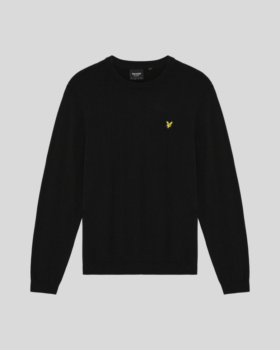 Man wears Cotton Merino Crew Neck Jumper in Jet Black