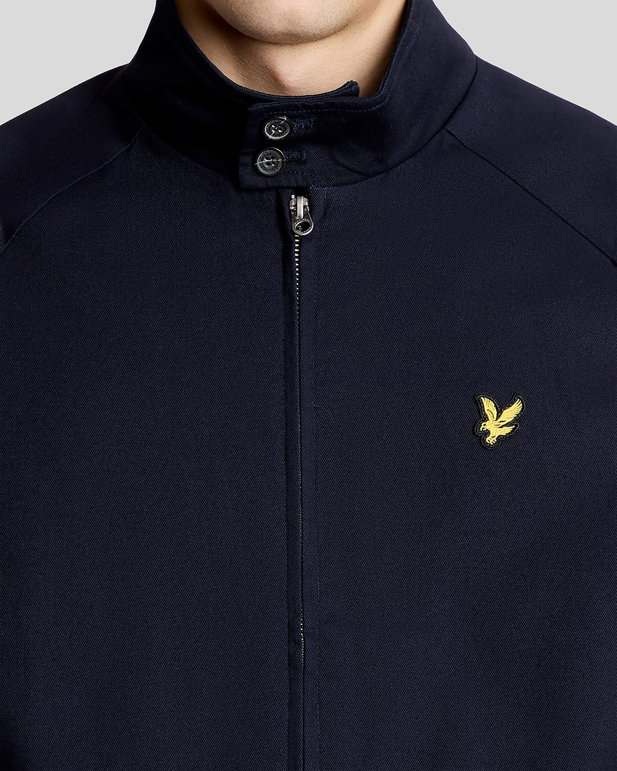 Man wears Cotton Harrington Jacket in Dark Navy