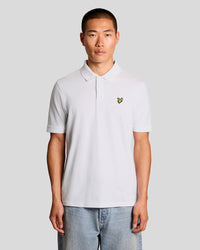 Man wears Jacquard Tipped Polo Shirt in White